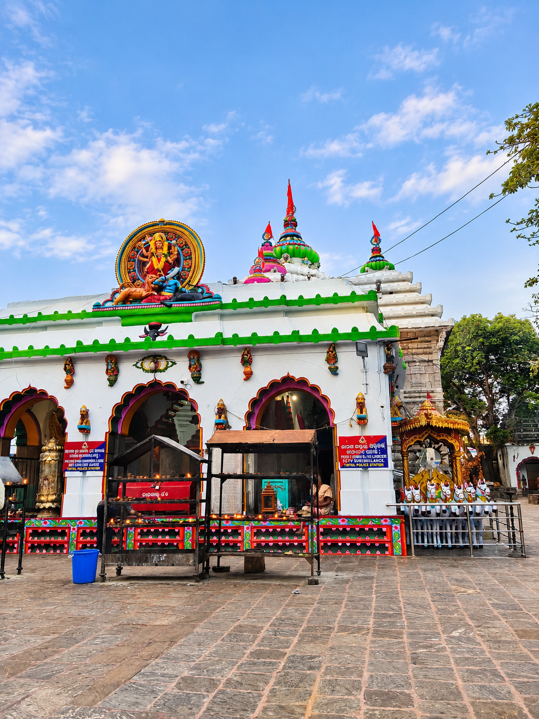 Lamp stands in front of Maa Sarala Temple